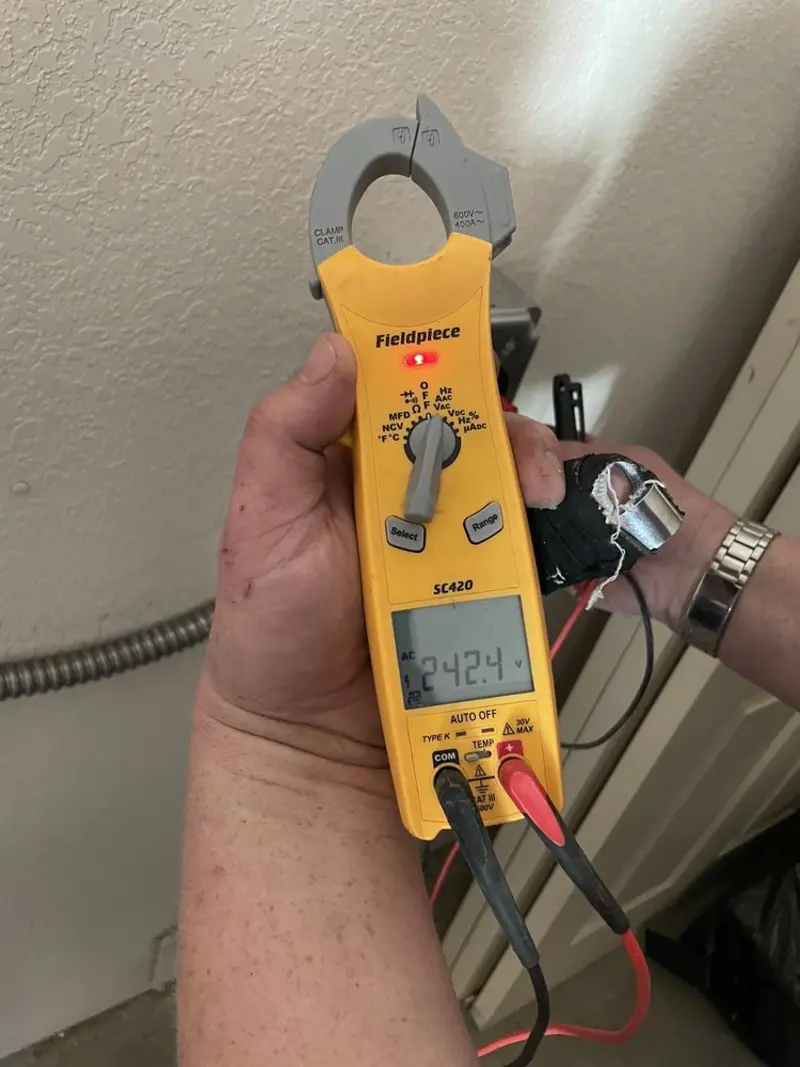 Voltage testing with clamp meter during Generator Installation in Charlotte Harbor